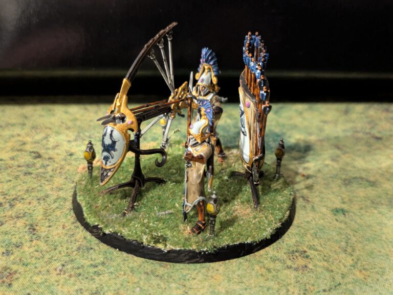 Side profile of a painted Lumineth Starshard Ballista showing the intricate mechanical details and clean white armor on the crew.