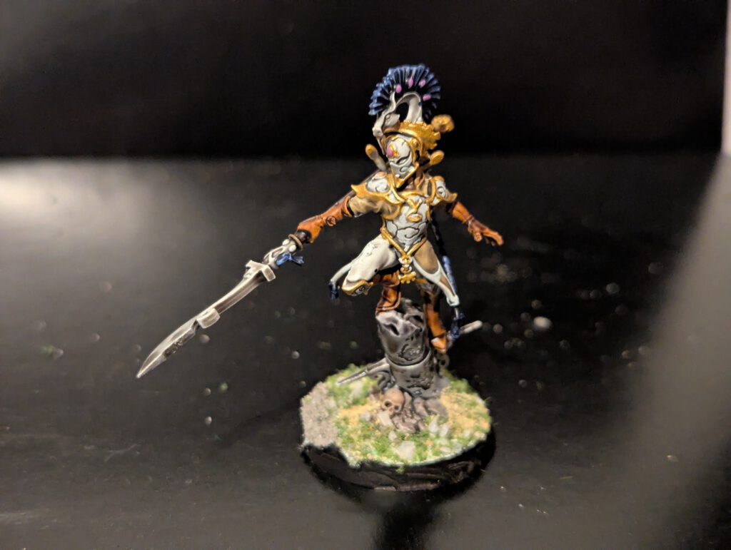 Detailed shot of an individual Ydrilan Riverblade miniature from the Iliathan Warhost, showcasing the movement and clean blue-to-white transitions.