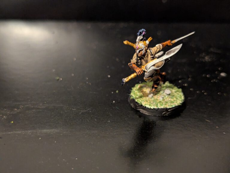 Detailed shot of an individual Ydrilan Riverblade miniature from the Iliathan Warhost, showcasing the movement and clean blue-to-white transitions.