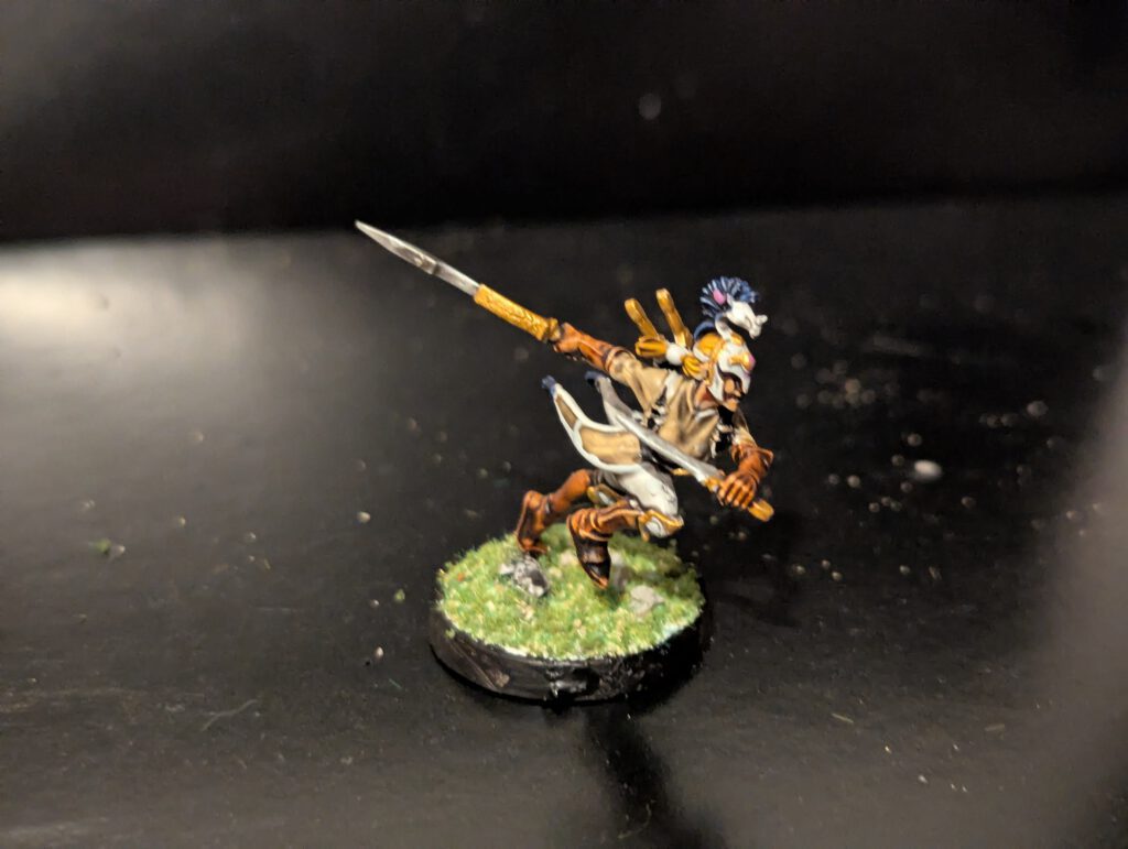 Detailed shot of an individual Ydrilan Riverblade miniature from the Iliathan Warhost, showcasing the movement and clean blue-to-white transitions.