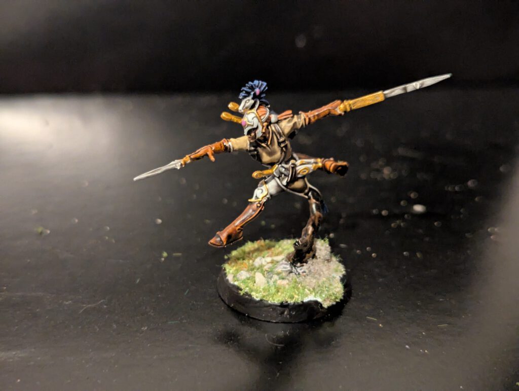 Detailed shot of an individual Ydrilan Riverblade miniature from the Iliathan Warhost, showcasing the movement and clean blue-to-white transitions.