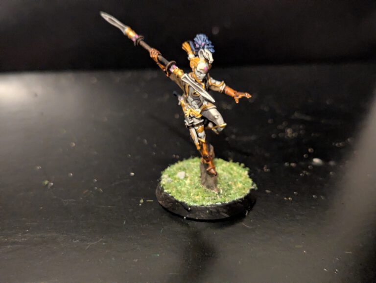 Detailed shot of an individual Ydrilan Riverblade miniature from the Iliathan Warhost, showcasing the movement and clean blue-to-white transitions.