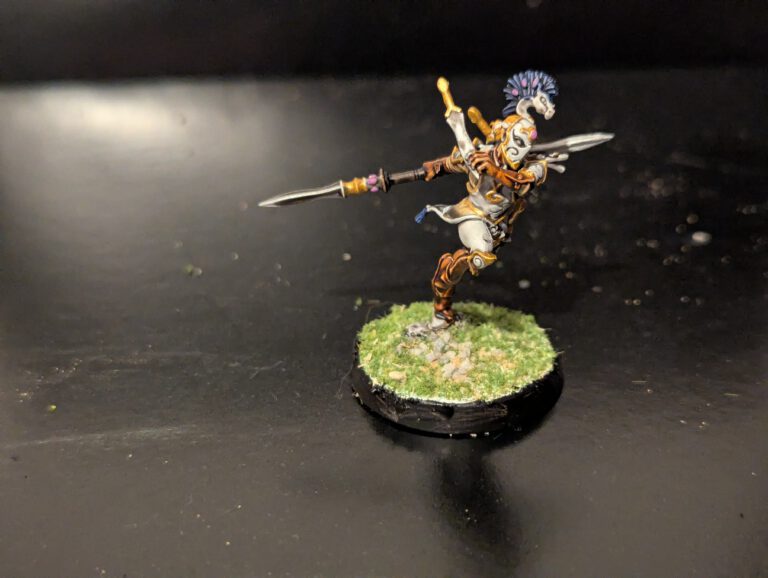 Detailed shot of an individual Ydrilan Riverblade miniature from the Iliathan Warhost, showcasing the movement and clean blue-to-white transitions.