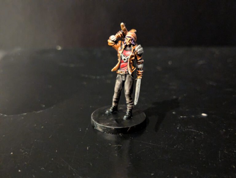 Painted Zeke Jeong miniature from Middara, featuring his signature coat and twin blades.