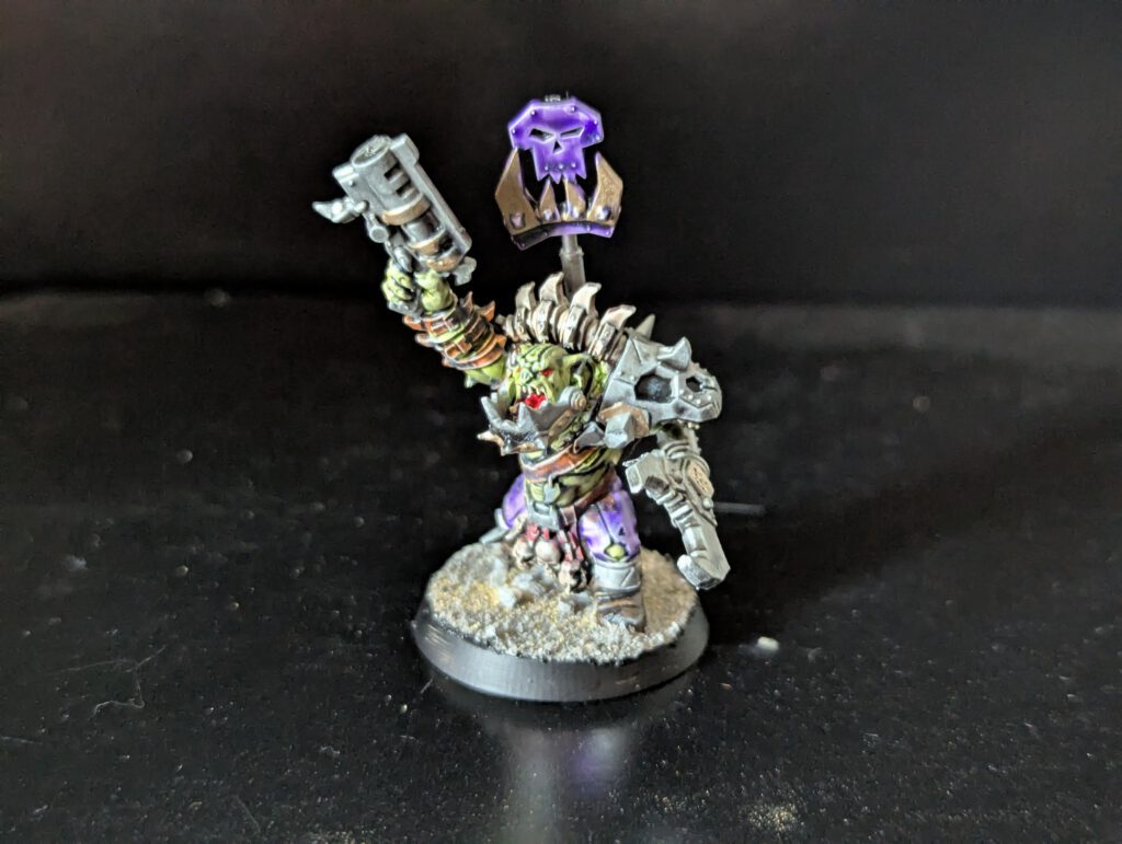 Individual painted Ork Beast Snagga Boy showing purple scheme and bone trophies.