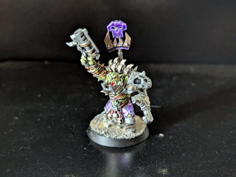 Individual painted Ork Beast Snagga Boy showing purple scheme and bone trophies.