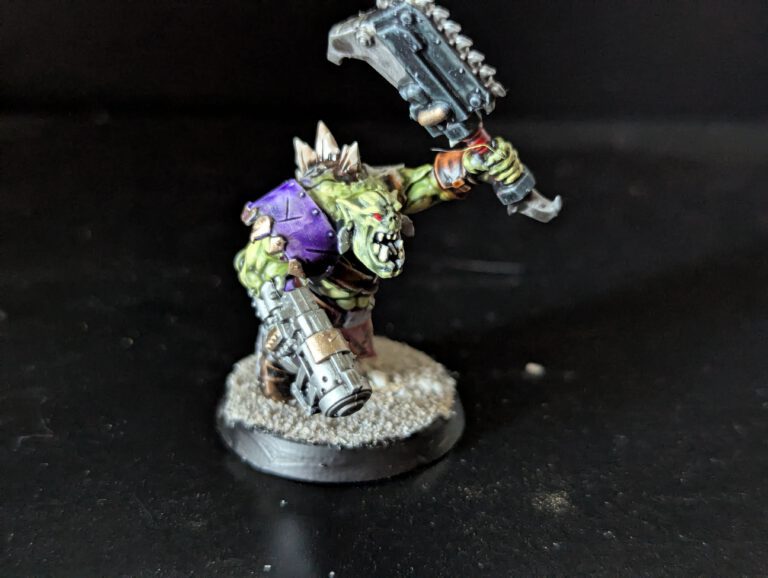 Individual painted Ork Beast Snagga Boy showing purple scheme and bone trophies.