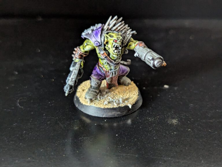 Individual painted Ork Beast Snagga Boy showing purple scheme and bone trophies.