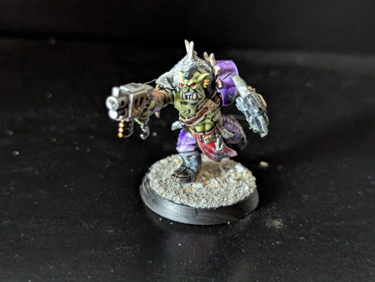 Individual painted Ork Beast Snagga Boy showing purple scheme and bone trophies.