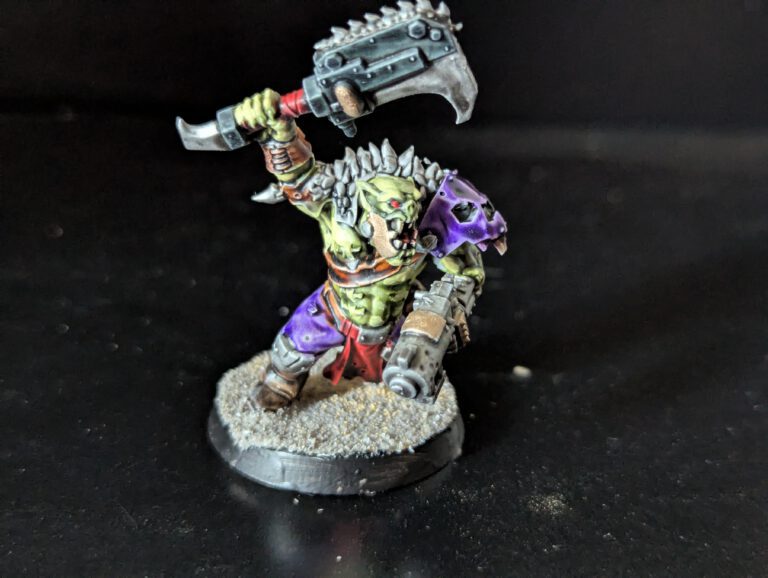Individual painted Ork Beast Snagga Boy showing purple scheme and bone trophies.