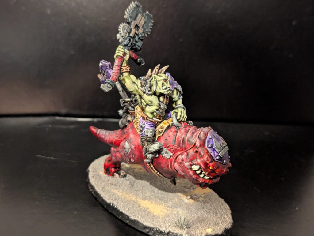 Front view of the Nob on Smasha Squig showing the armored squig head and Ork rider.