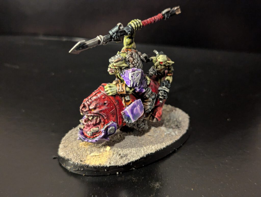 A painted Squighog rider galloping.