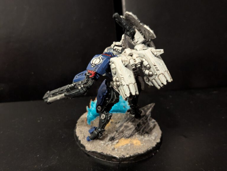 Back view of the second T'au Battlesuit showing the detailed paintwork on the stabilization fins.