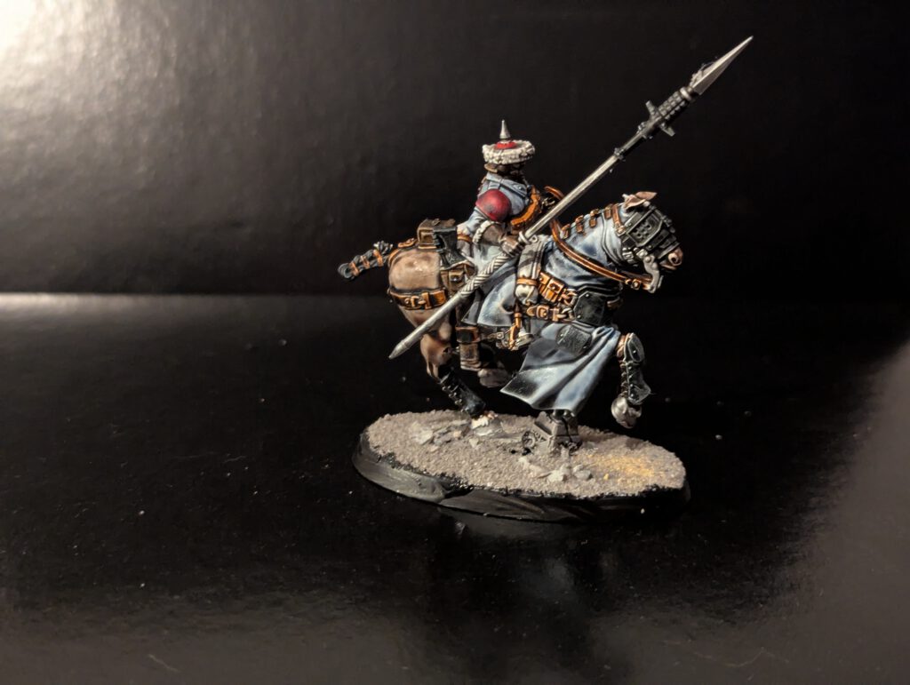 Individual shot of a mounted trooper showing off the detailed metal armor plating on the horse's flank.