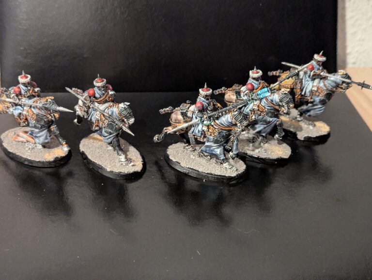 Five Astra Militarum Attilan Rough Riders mounted on horses, charging forward with hunting lances raised.
