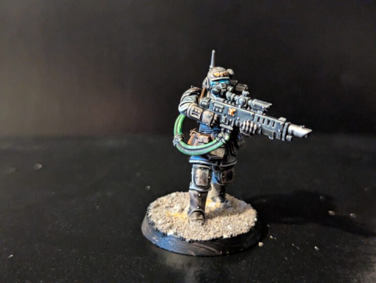 Heavy weapon Kasrkin trooper holding a hot-shot volley gun with a detailed power cable attached to the backpack.